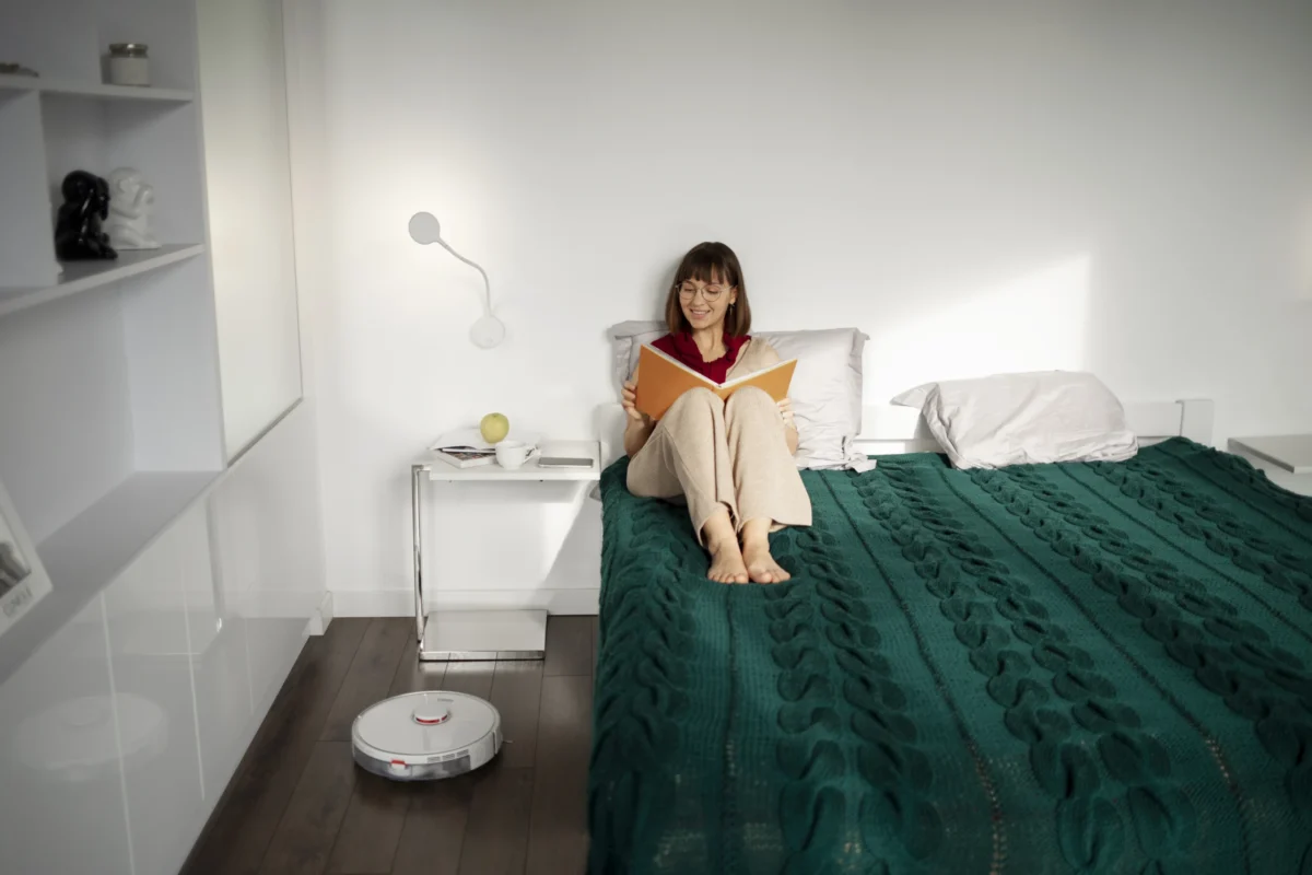 A peaceful modern bedroom in 2026 featuring "satisfying bedroom gadgets" like a galaxy projector and smart ambient lighting.